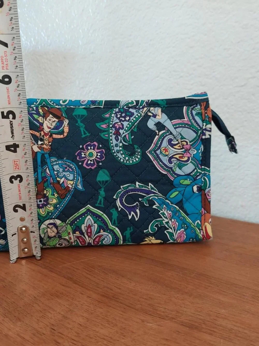 vera bradley Disney Toy Story quilted pouch with characters in a paisley design